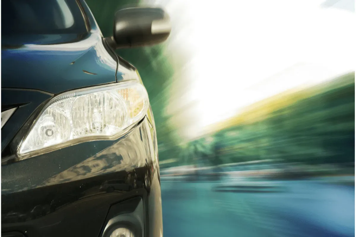 A close-up of a car driving on the road